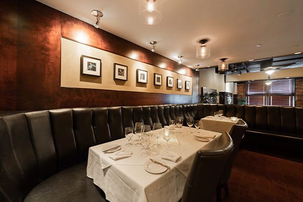 Vintage Chophouse Dining Room Reservations Vintage Chophouse dining room with elegant table settings for reservations