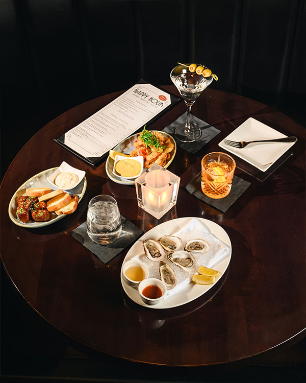 Vintage Chophouse Happy Hour with Oysters and Cocktails Vintage Chophouse happy hour table with oysters, cocktails, tapas and menu