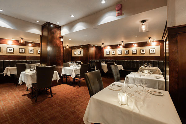 Vintage Chophouse Private Dining – Upper Bistro Vintage Chophouse Upper Bistro private dining room with elegant table settings